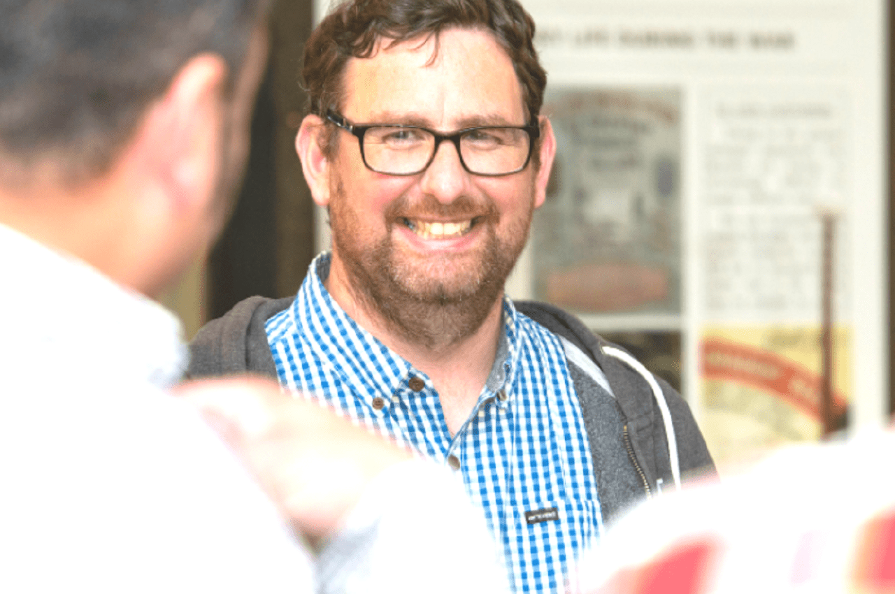 Staff members smiling at the company’s 50th anniversary.